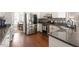 Open concept kitchen features stainless steel appliances and leads into dining area at 3908 Yateswood Ct, Raleigh, NC 27603
