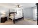 Spacious main bedroom boasts a four-poster bed, ceiling fan, and natural lighting at 3908 Yateswood Ct, Raleigh, NC 27603