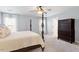 Main bedroom features a four-poster bed, ceiling fan, natural lighting, and closet access at 3908 Yateswood Ct, Raleigh, NC 27603