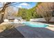 Refreshing backyard swimming pool with surrounding patio and lounge area at 3908 Yateswood Ct, Raleigh, NC 27603