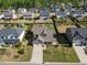 Aerial view of a landscaped home with a backyard and surrounding neighborhood at 405 Club Center Dr, Youngsville, NC 27596