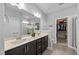 Spacious bathroom with double sinks, large mirror, and walk-in closet, providing ample space at 405 Club Center Dr, Youngsville, NC 27596