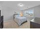 Bedroom with neutral carpet, a queen bed, and a large window at 405 Club Center Dr, Youngsville, NC 27596