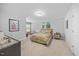 Inviting bedroom with cozy carpet, natural light, and peaceful decor at 405 Club Center Dr, Youngsville, NC 27596