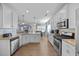 Spacious open-concept kitchen featuring granite countertops and stainless steel appliances at 405 Club Center Dr, Youngsville, NC 27596