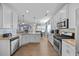 Open concept kitchen with stainless appliances, granite countertops and adjacent dining area at 405 Club Center Dr, Youngsville, NC 27596
