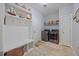 Functional laundry room with modern washer/dryer and ample storage for convenience at 405 Club Center Dr, Youngsville, NC 27596