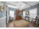 Elegant dining room with coffered ceiling, hardwood floors, and large windows providing ample natural light at 405 Club Center Dr, Youngsville, NC 27596