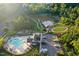 Aerial view of neighborhood amenities, featuring pool, park, pond, and parking at 425 Summit Trail Dr, Hillsborough, NC 27278