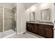 Modern bathroom features a glass enclosed shower and double sink vanity at 425 Summit Trail Dr, Hillsborough, NC 27278