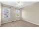 Bedroom with carpet floors and two windows allowing natural light at 425 Summit Trail Dr, Hillsborough, NC 27278