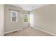 Neutral bedroom featuring carpet flooring, a ceiling fan, and windows that let in natural light at 425 Summit Trail Dr, Hillsborough, NC 27278