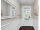 Bright foyer features a large mirror, coat hooks and a white paneled wall at 425 Summit Trail Dr, Hillsborough, NC 27278