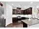 Gourmet kitchen featuring stainless steel appliances, granite countertops, and ample cabinet space at 425 Summit Trail Dr, Hillsborough, NC 27278