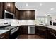 Modern kitchen featuring stainless steel appliances and granite countertops at 425 Summit Trail Dr, Hillsborough, NC 27278