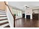 Spacious living area featuring a fireplace, large windows, and hardwood floors at 425 Summit Trail Dr, Hillsborough, NC 27278