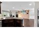 Open-concept living space featuring a kitchen island that overlooks the living room at 425 Summit Trail Dr, Hillsborough, NC 27278