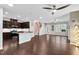 Spacious living area with dark wood floors, a kitchen island and lots of natural light at 425 Summit Trail Dr, Hillsborough, NC 27278