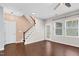 Open concept living room with beautiful hardwood floors and staircase at 425 Summit Trail Dr, Hillsborough, NC 27278