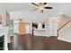 Open-concept living area with dark hardwood floors and seamless transition to the kitchen at 425 Summit Trail Dr, Hillsborough, NC 27278