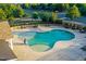 Community pool with ample lounge seating, pergola covered tables, and immaculately kept pool and patio at 425 Summit Trail Dr, Hillsborough, NC 27278