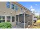 View of screened porch, featuring cozy outdoor seating and backyard access, offering a relaxing retreat at 425 Summit Trail Dr, Hillsborough, NC 27278