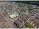 A beautiful aerial view showcasing community living with a pool, park, and sidewalks amongst well-maintained homes at 4905 Abundance Ave, Raleigh, NC 27616