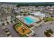 Aerial view of the community pool, playground, and neighborhood at 4905 Abundance Ave, Raleigh, NC 27616