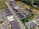 Overhead perspective of modern apartment complex with pool, parking, pond, and playground amenities for residents at 4905 Abundance Ave, Raleigh, NC 27616
