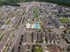 Expansive aerial view of a well-planned community with a central pool, park, and tree-lined streets at 4905 Abundance Ave, Raleigh, NC 27616