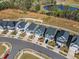 A stunning aerial view of a row of two-story homes, showcasing their modern design and manicured lawns at 4905 Abundance Ave, Raleigh, NC 27616