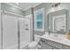 Bright bathroom featuring a sleek glass shower, creating a refreshing and modern space at 4905 Abundance Ave, Raleigh, NC 27616