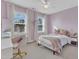 Charming bedroom featuring a large window and a cozy bed, creating a peaceful retreat at 4905 Abundance Ave, Raleigh, NC 27616
