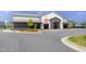 Exterior view of a commercial building featuring outdoor seating and inviting facade at 4905 Abundance Ave, Raleigh, NC 27616