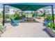 Community garden with a picnic table and adirondack chairs under a shade shelter offers residents space to grow and relax at 4905 Abundance Ave, Raleigh, NC 27616