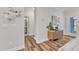 Hallway with hardwood floors and entrance to the bathroom at 4905 Abundance Ave, Raleigh, NC 27616