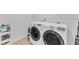 Bright laundry room featuring a modern washer and dryer set at 4905 Abundance Ave, Raleigh, NC 27616