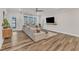 Comfortable living room features a sectional sofa, TV, and natural light at 4905 Abundance Ave, Raleigh, NC 27616