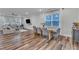 Open-concept living space features hardwood floors, connecting living, dining, and kitchen areas at 4905 Abundance Ave, Raleigh, NC 27616