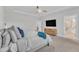 Spacious bedroom featuring ceiling fan, television, and walk in shower at 4905 Abundance Ave, Raleigh, NC 27616