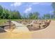 Outdoor activity area with climbing rocks, a slide, and natural landscaping for fun physical activity at 4905 Abundance Ave, Raleigh, NC 27616