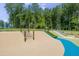 Community playground with net climber, slide, and soft ground cover perfect for to be active and have fun at 4905 Abundance Ave, Raleigh, NC 27616