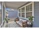 Inviting screened porch with comfortable seating and stylish decor, perfect for relaxation at 4905 Abundance Ave, Raleigh, NC 27616