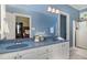 Dual sink bathroom with walk-in shower, and blue countertops at 495 Evans Rd, Princeton, NC 27569