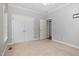 Bedroom featuring neutral carpet, paint and a large closet at 495 Evans Rd, Princeton, NC 27569
