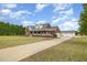 Desirable brick home with a long driveway, detached garage, and appealing front porch, set on a large lot at 495 Evans Rd, Princeton, NC 27569