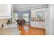 Cozy kitchen featuring a breakfast nook with corner windows and hardwood floors, perfect for enjoying meals at 495 Evans Rd, Princeton, NC 27569