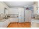 Bright kitchen equipped with white cabinetry, granite countertops, and stainless steel appliances for a modern touch at 495 Evans Rd, Princeton, NC 27569