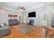 Comfortable living area with a fireplace, hardwood floors, and plenty of natural light perfect for Gathering gatherings at 495 Evans Rd, Princeton, NC 27569