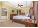 Spacious main bedroom featuring tray ceiling, carpet, and ensuite bathroom at 495 Evans Rd, Princeton, NC 27569